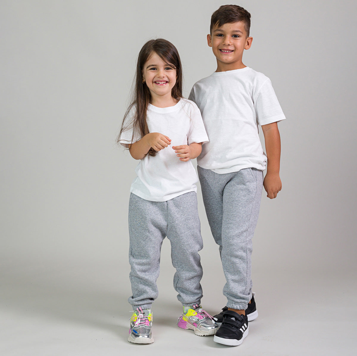 Pantaloni trening copii cu buzunare gri melange